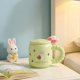thumbnail image 4 of Taza de café de conejo de Pascua con tapa y cuchara, taza de cerámica mona con caja de regalo para café o té, regalos de Pascua de primavera para decoración del hogar o de la oficina, 4 of 7