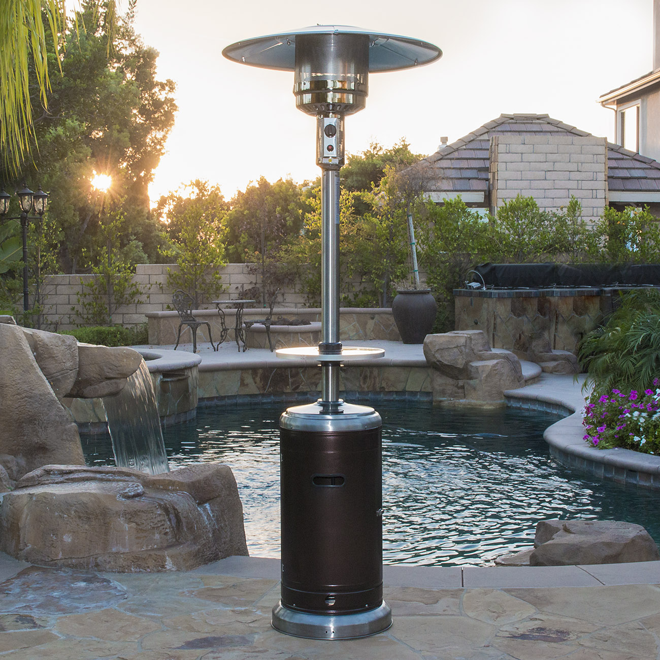 A stainless steel patio heater by a pool. Links to the best patio heaters on Walmart.com.