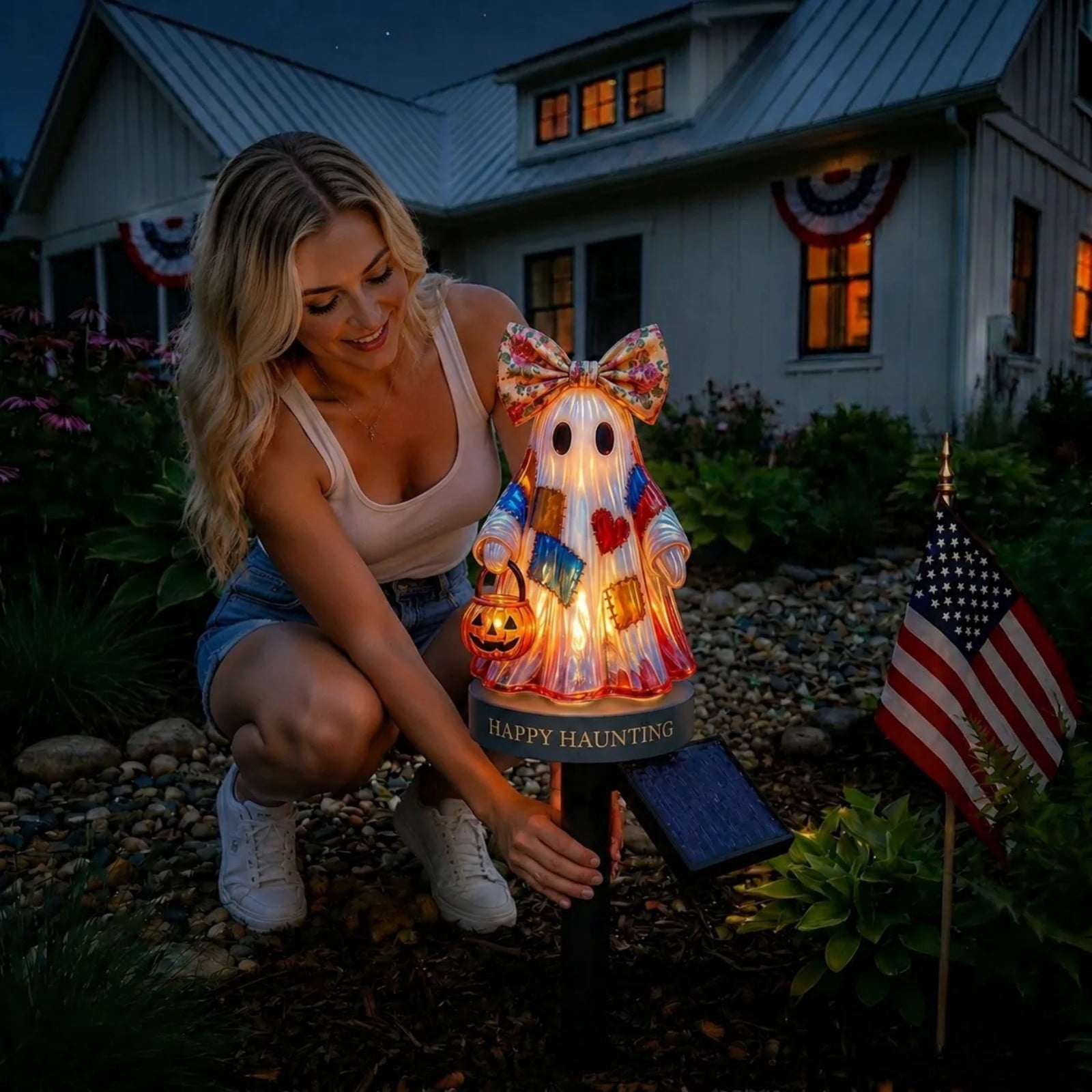 Woman installing the solar ghost decoration in her garden