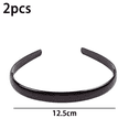 thumbnail image 2 of Juego de 2 diademas con peine para el pelo de plástico negro con forma de diente de tiburón, 2 of 5