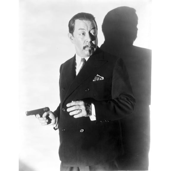 Warner Oland holding a gun Photo Print (24 x 30)