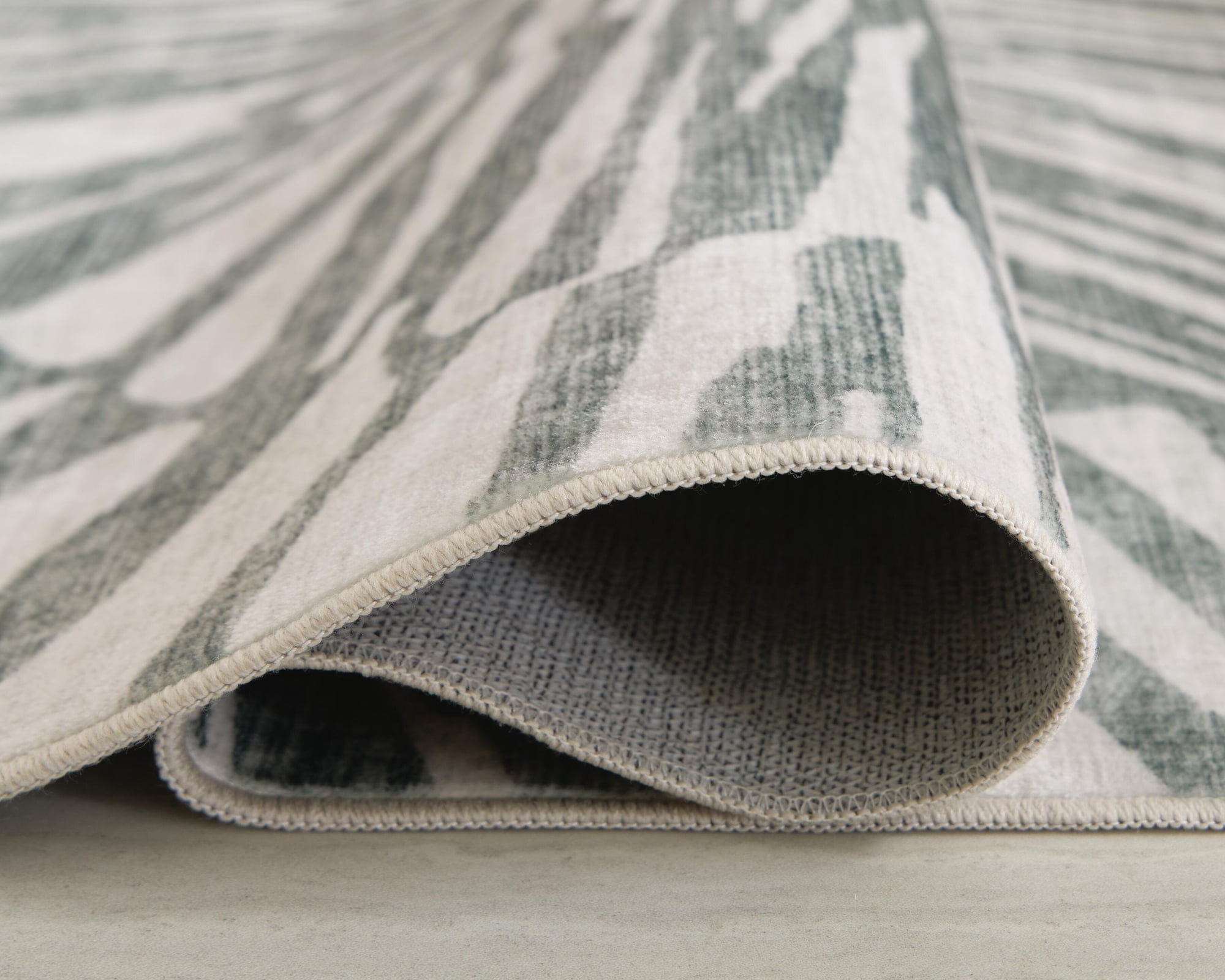 Signature Design by Ashley Verland 5' x 7' Washable Area Rug, Gray/White Sunburst Faux Fur Rug