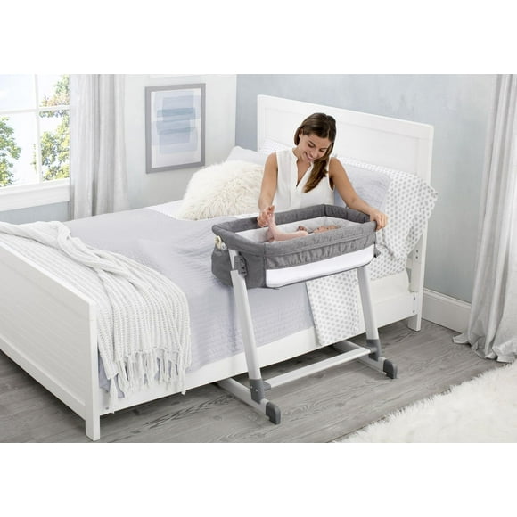 Berceau de Luxe près du lit de Delta Children, gris tweed