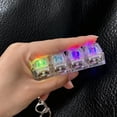 thumbnail image 3 of Llavero con teclado mecánico, colgante, juguete antiestrés con sonido táctil, botones de luz LED transparentes, llavero portátil, 3 of 7