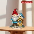 thumbnail image 1 of Rotatable acrylic ornament featuring a stained glass gnome in red hat and turquoise shirt next to a birdhouse with a blue bird on top, 1 of 8
