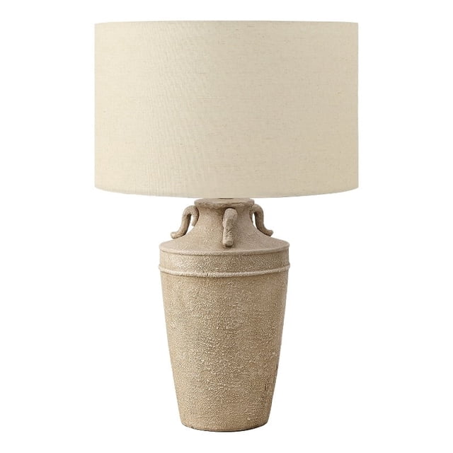 Lighting - 28"h - Table Lamp - Beige Ceramic - Beige Shade - Transitional. A front-facing view of a 28-inch table lamp with a textured beige ceramic base featuring handles on top and a beige fabric shade. This decorative lighting piece offers ambient lighting and is ideal for living rooms, bedrooms, or home offices. Equipped with a 3-way switch for adjustable light intensity when paired with a 3-way bulb up to 100W (not included).