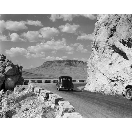 1930s-1940s Car Driving On Mountain Road In Yellowstone National Park Near Cody Wyoming Usa Print By Vintage