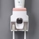thumbnail image 1 of Dispensador de pasta de dientes rosa y soporte para cepillo de dientes, exprimidor automático de pasta de dientes para montaje en pared, 1 of 5