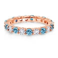 thumbnail image 2 of Gem Stone King 18K Rose Gold Plated Silver Round Swiss Blue Topaz and White Created Sapphire Eternity Band Ring for Women (1.50 Cttw, Gemstone Birthstone, Size 8), 2 of 6