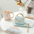 thumbnail image 3 of NOGIS Handbag Shaped Mug Ceramic Coffee Cup with Spoon and Saucer 10 oz/ 310 ml Cute Tea Cup Set Creative Travel Handbag Mug with Gift Box for Women Office Home Mother's Day Gifts (Blue), 3 of 7