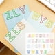 thumbnail image 1 of Conjunto de clips metálicos con forma de letra multicolor para organización de documentos en oficina, colegios y personalizados, 1 of 5