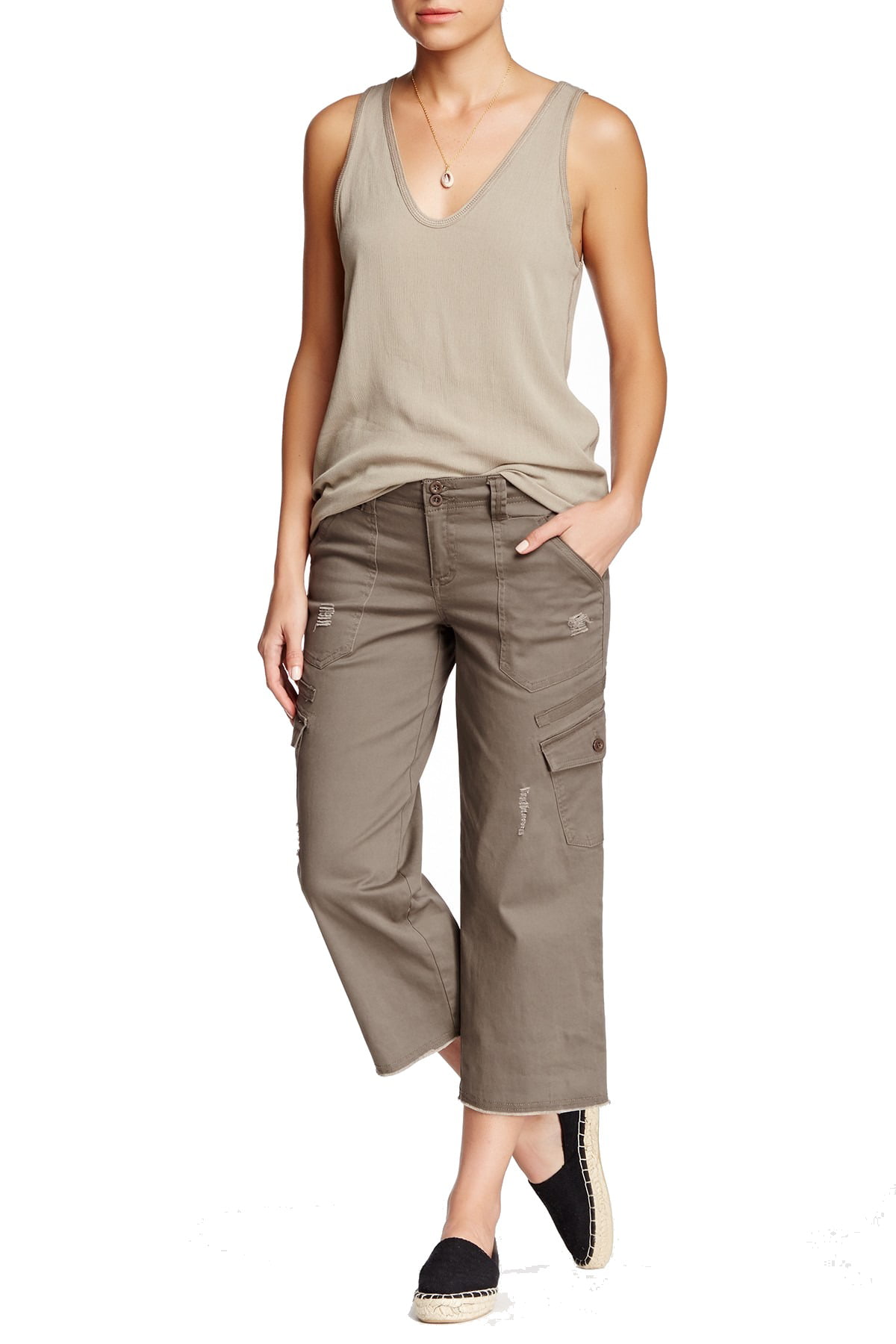 A woman in a pair of olive green cropped cargo pants.