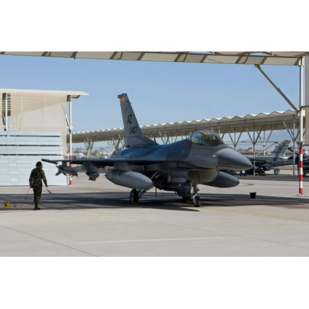 - A pilot conducts preflight checks on his F-16 Fighting Falcon Poster Print by HIGH-G ProductionsStocktrek Images