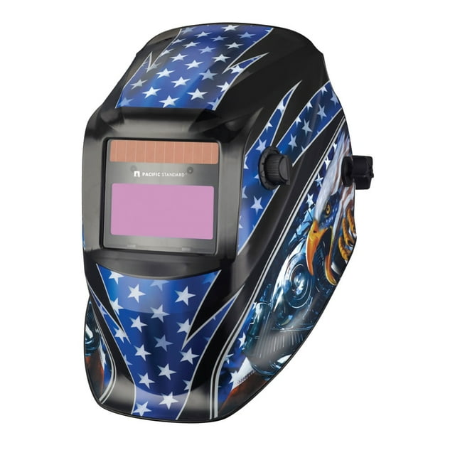 careta electrónica pacific standard stars 2 sensores som/var Multicolor — Vista 3/4 frontal de careta de soldar con carcasa plástica ligera y diseño azul con estrellas blancas; visor fotosensible rectangular frontal y panel solar sobre la parte superior; perilla externa para control de sombra variable, área de visión 92 x 42 mm, peso 480 g, respuesta 1/15000 y 2 sensores de alta sensibilidad. También suele usarse como protección portátil en trabajos de mantenimiento y bricolaje.