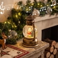 thumbnail image 2 of Christmas Musical Snow Globe Lantern, Water Filled Night Light, Oil Lamp Style Body with Swirling Glitter Warm Light and Eight Melodies, Tabletop Decor for Mantel Shelf or Bedside, 2 of 6