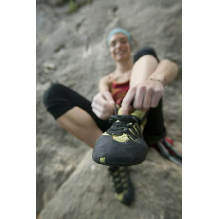 Woman Putting on Rock Climbing Shoes Print Wall Art By Anthony