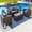 Sunbrella Canvas Charcoal, variant on Tuscany 4-Piece M Resin Wicker Outdoor Patio Furniture Conversation Sofa Set with Loveseat, Two Armchairs, and Coffee Table (Half-Round Brown Wicker, Polyester Light Gray)