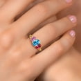 thumbnail image 4 of Gem Stone King 18K Yellow Gold Plated Silver Swiss Blue Topaz and Pink Moissanite Filigree Style 3 Stone Ring for Women (2.42 Cttw, Oval 8X6MM and 6X4MM, Available in Size 5, 6, 7, 8, 9), 4 of 5