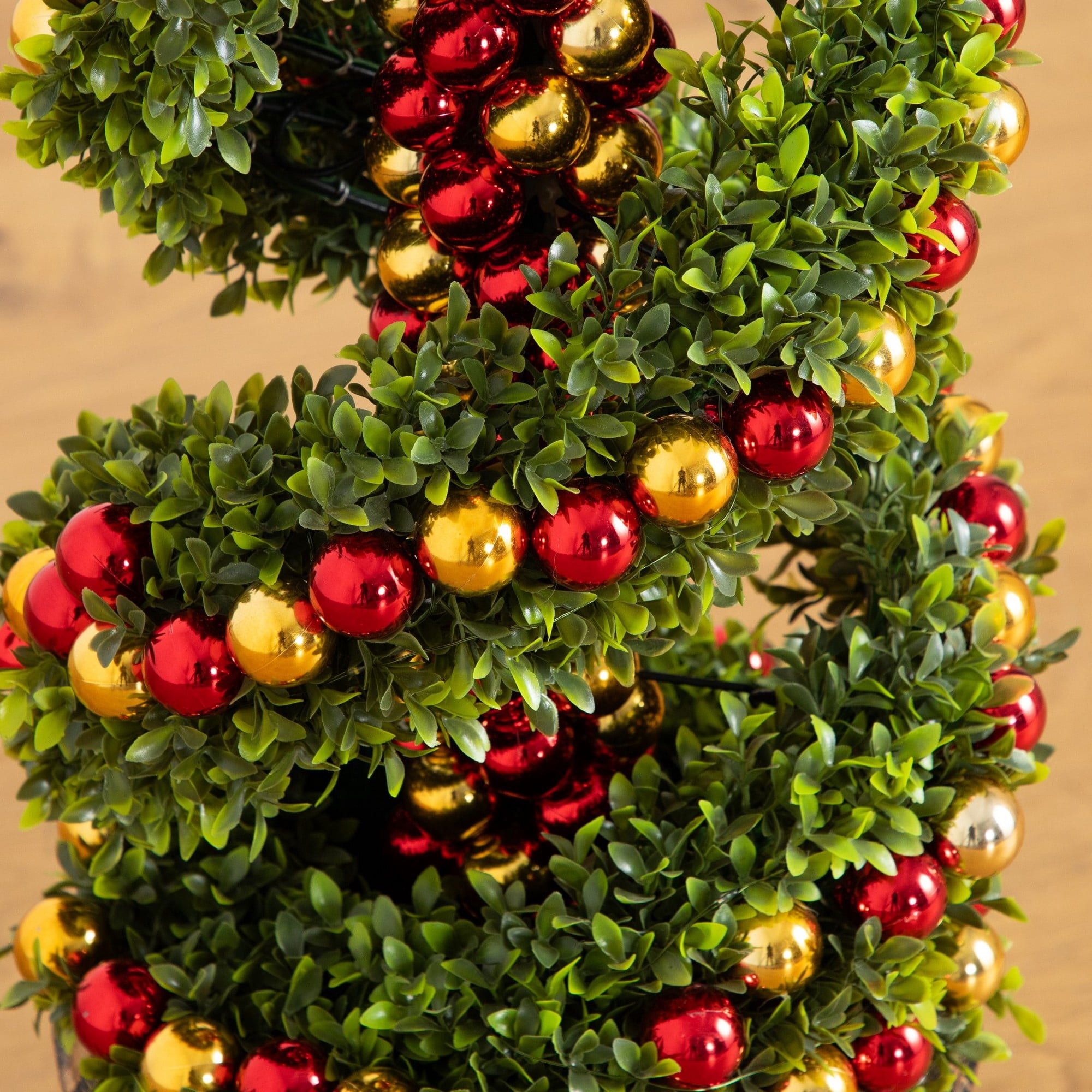 3ft. Pre-Lit Artificial Christmas Spiral Boxwood Topiary Tree with Ornaments and 70 LED Lights in Decorative Urn