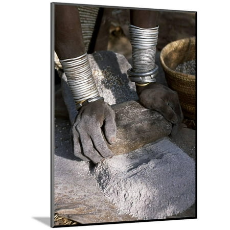 Ethiopian Wood - Nyagatom Woman Grinds Sorghum Using Two Stones, Omo River, South-Western Ethiopia Wood Mounted Print Wall Art By John Warburton-lee