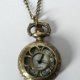 thumbnail image 5 of Reloj de Bolsillo en Tono Bronce con Textura Floral y Caja Hunter, Reloj de Bolsillo para Mujer, Reloj con Collar, 5 of 8