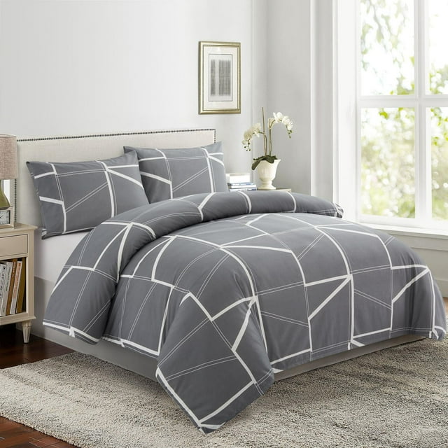 Ultra soft gray rayon from bamboo duvet cover and pillowcases featuring a modern fantasy geometric white line pattern, displayed on a bed in a sunlit room.