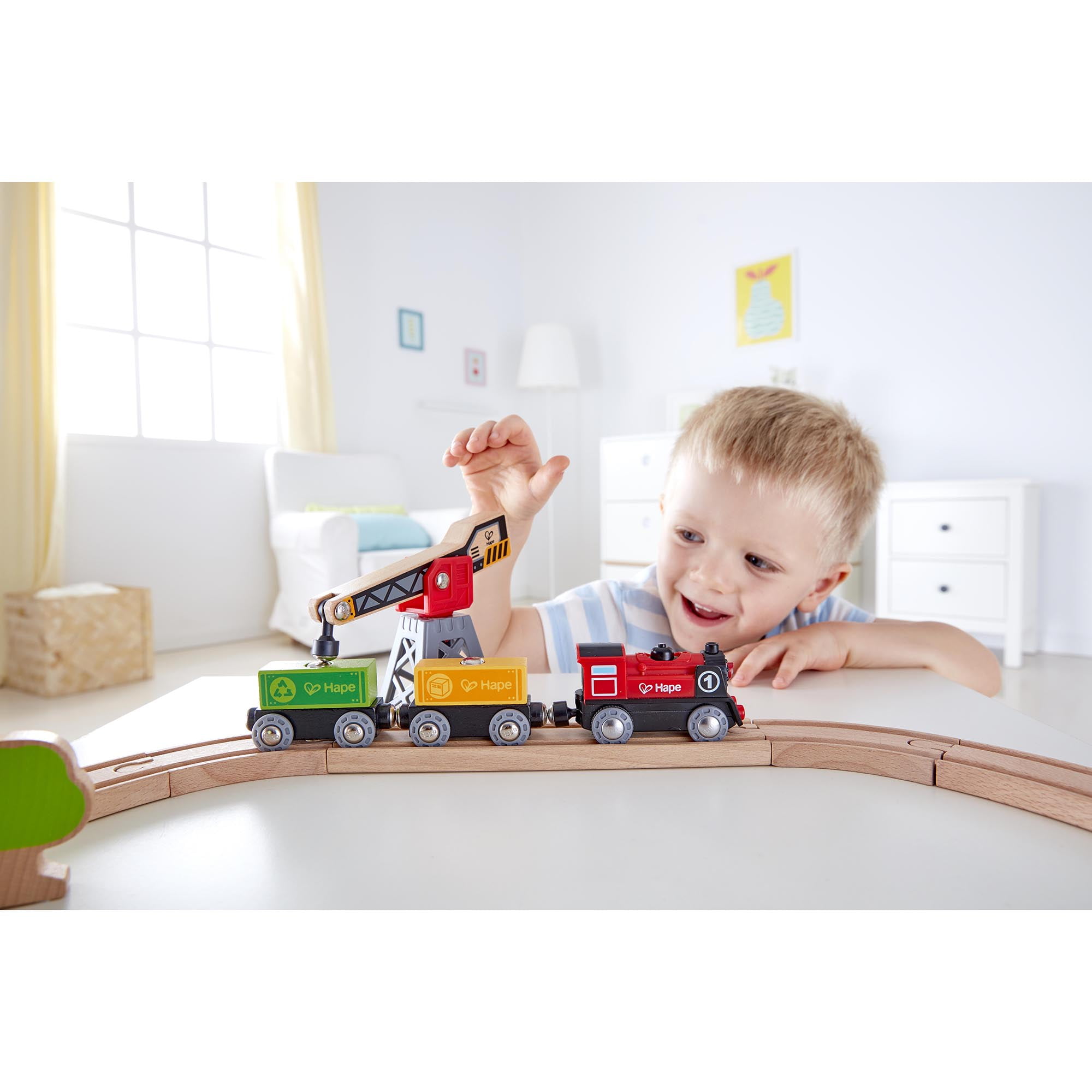 Hape: Cargo Delivery Loop - Battery Powered Engine, Oval Track Railway Set, Wooden Toy, 3 Magnetic Linking Trains, Crane, Accessories, Kids Ages 3+