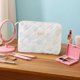 thumbnail image 2 of Bolsa de cosméticos de gran capacidad con estampado floral y doble cremallera. Organizador de maquillaje de viaje para guardar artículos de aseo y papelería, 2 of 4