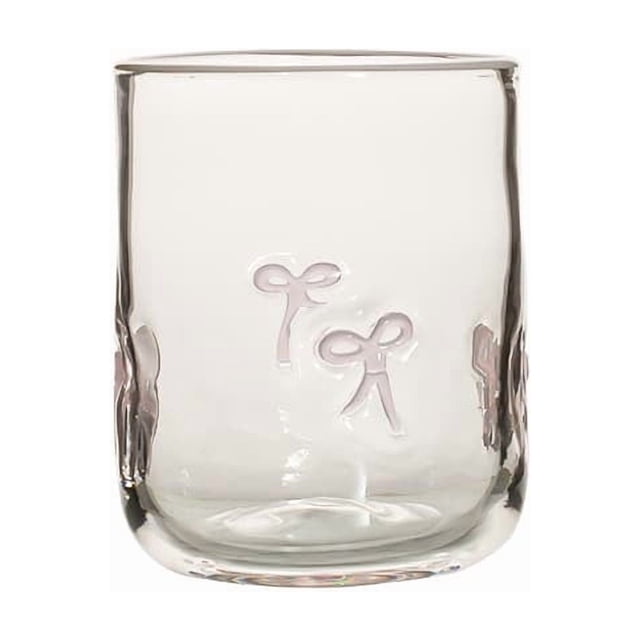 Artisanal colorful glass cup with heat design, featuring a clear glass body adorned with delicate bow-shaped accents. Ideal for serving hot and cold beverages, this cup is crafted for home kitchen use or as a unique decorative idea. The durable glass material and festive design make it suitable for various settings, including living rooms, studies, or bedrooms.