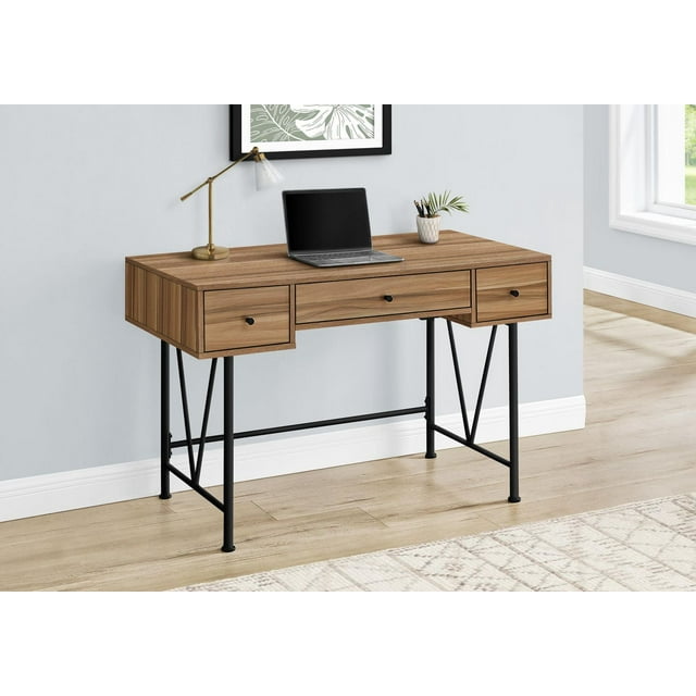 Transitional style 48-inch brown wood laminate computer desk with black metal frame and three storage drawers, shown in a home office setting with a laptop on top.