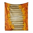 thumbnail image 1 of Fall Soft Flannel Fleece Throw Blanket, Fallen Leaves on Wooden Wall September Foliage Rustic Style Print, Cozy Plush for Indoor and Outdoor Use, 50" x 60", Pale Coffee Marigold, by Ambesonne, 1 of 6