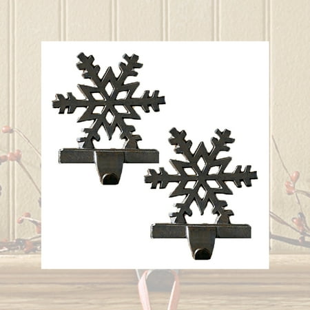 - Snowflake Stocking Hangers Holders Cast Iron Black or White Set of 2