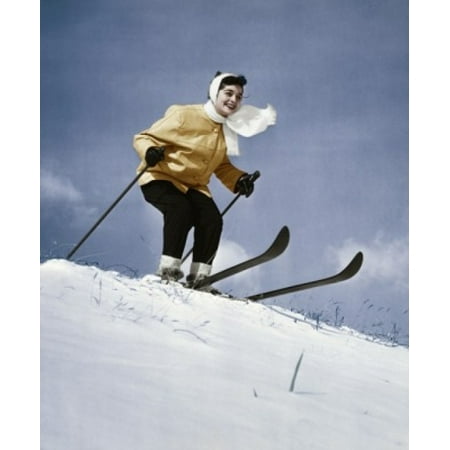Low angle view of young woman skiing downhill Canvas Art - (24 x 36)