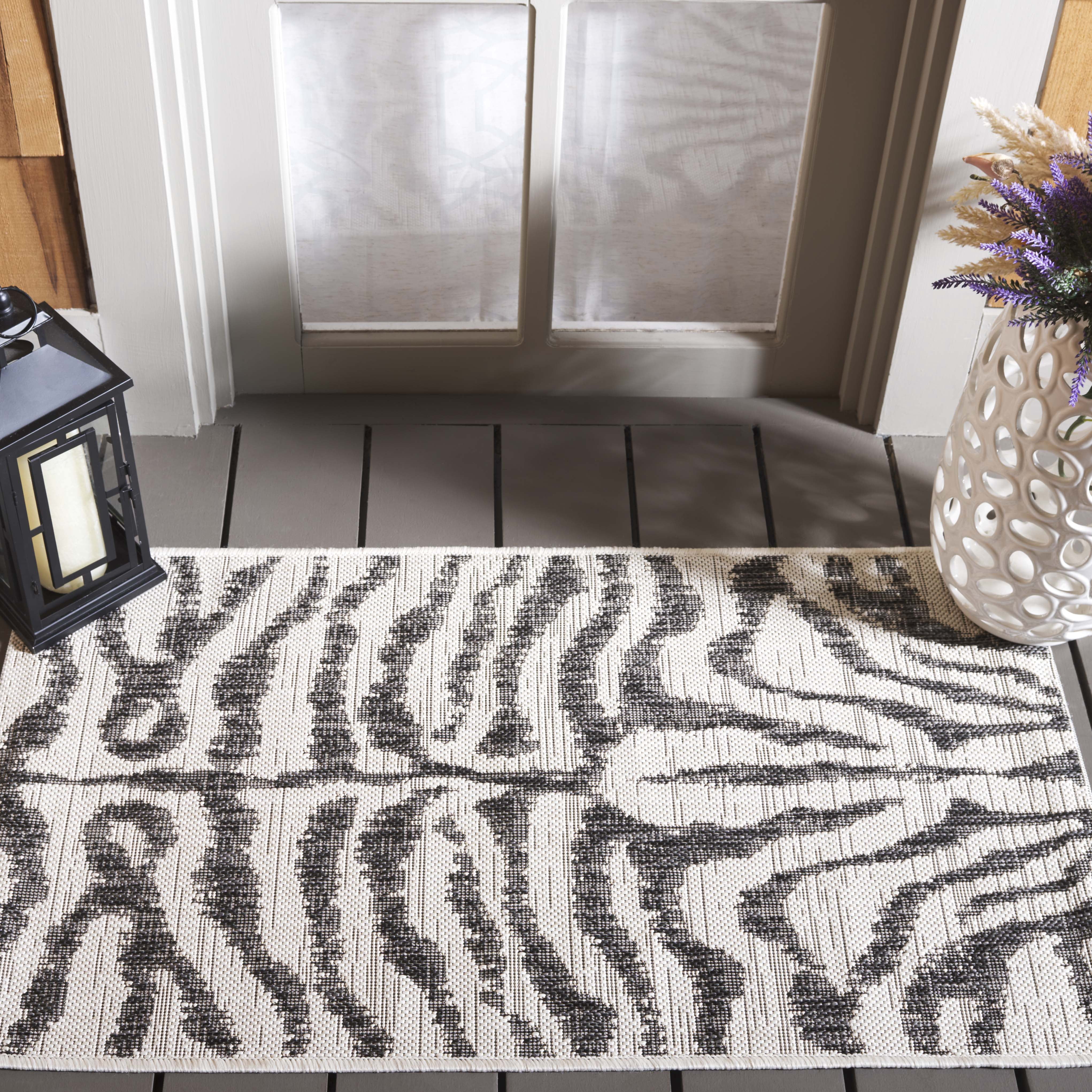 SAFAVIEH Courtyard Gerald Animal Indoor/Outdoor Area Rug, Ivory/Black, 2' x 3'7"