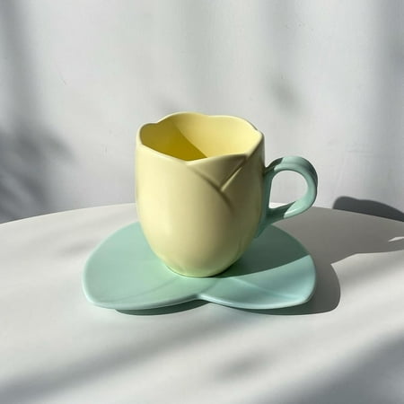

QIBAXXYL Stylish and charming the perfect Tulip Krus mug set for the office. Elegant ceramic tea cup and saucer with coaster for stylish coffee breaks and relaxing afternoons.