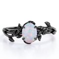 thumbnail image 1 of JeenMata Inspirado en la Naturaleza: Ópalo Arcoíris de Forma Ovalada de 0,5 Quilates, Anillo de Compromiso con Engaste de Cuatro Puntas, Baño de Oro Negro de 18 K sobre Plata, 1 of 5