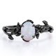 thumbnail image 1 of JeenMata Inspirado en la Naturaleza: Ópalo Arcoíris de Forma Ovalada de 0,5 Quilates, Anillo de Compromiso con Engaste de Cuatro Puntas, Baño de Oro Negro de 18 K sobre Plata, 1 of 5