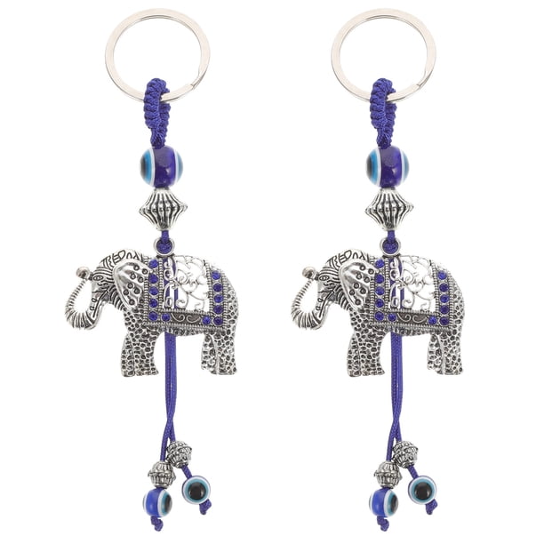 2 llaveros colgantes con forma de elefante, diablo y ojos azules para coche.