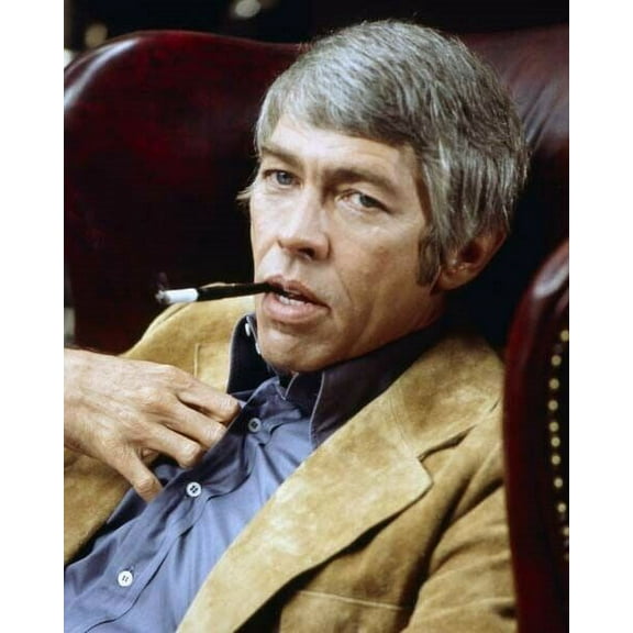 James Coburn suave looking portrait circa 1972 with cigarette holder poster