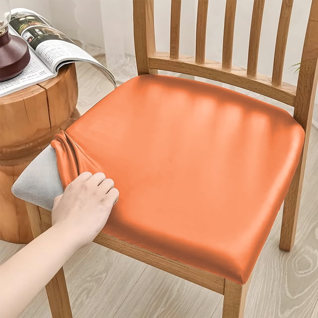Nvzi Funda de asiento de cuero sintético PU - Juego de 2 piezas, tamaño pequeño (14-18.9 pulgadas), impermeable, con elástico, ideal para sillas de cocina y del hogar. Color naranja.