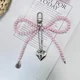 thumbnail image 1 of Llavero de corazón de lazo blanco plateado para mujer, llavero de mochila con lazo de perla, joyería hecha a mano, adorno de bolsos, colgantes Gif, 1 of 5