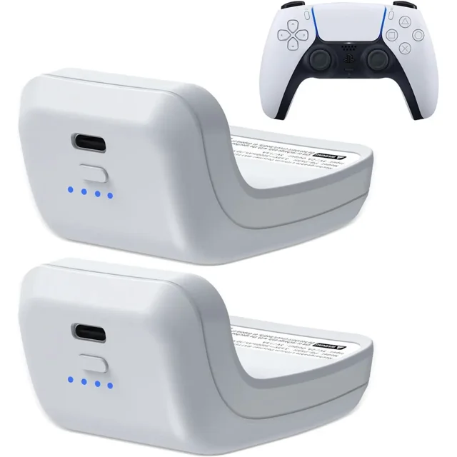 2X 3000mAh PS5 Controller External Battery Pack by BONAEVER, designed for Sony PlayStation 5 DualSense controllers. The image shows two compact, white battery packs with USB-C ports and four blue LED indicator lights for battery capacity. A PS5 DualSense controller is displayed in the background for compatibility reference. These battery extenders provide double the runtime, include a Type-C charging cable, and feature built-in safety protections such as overcharge and short-circuit prevention.