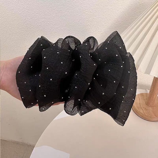 Elegante horquilla de alta gama con forma de tiburón y pinza para el pelo de plumas negras grandes para mujer