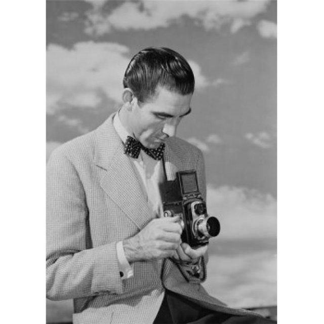 Posterazzi SAL255419090 Man Using Camera Poster Print - 18 x 24 in.