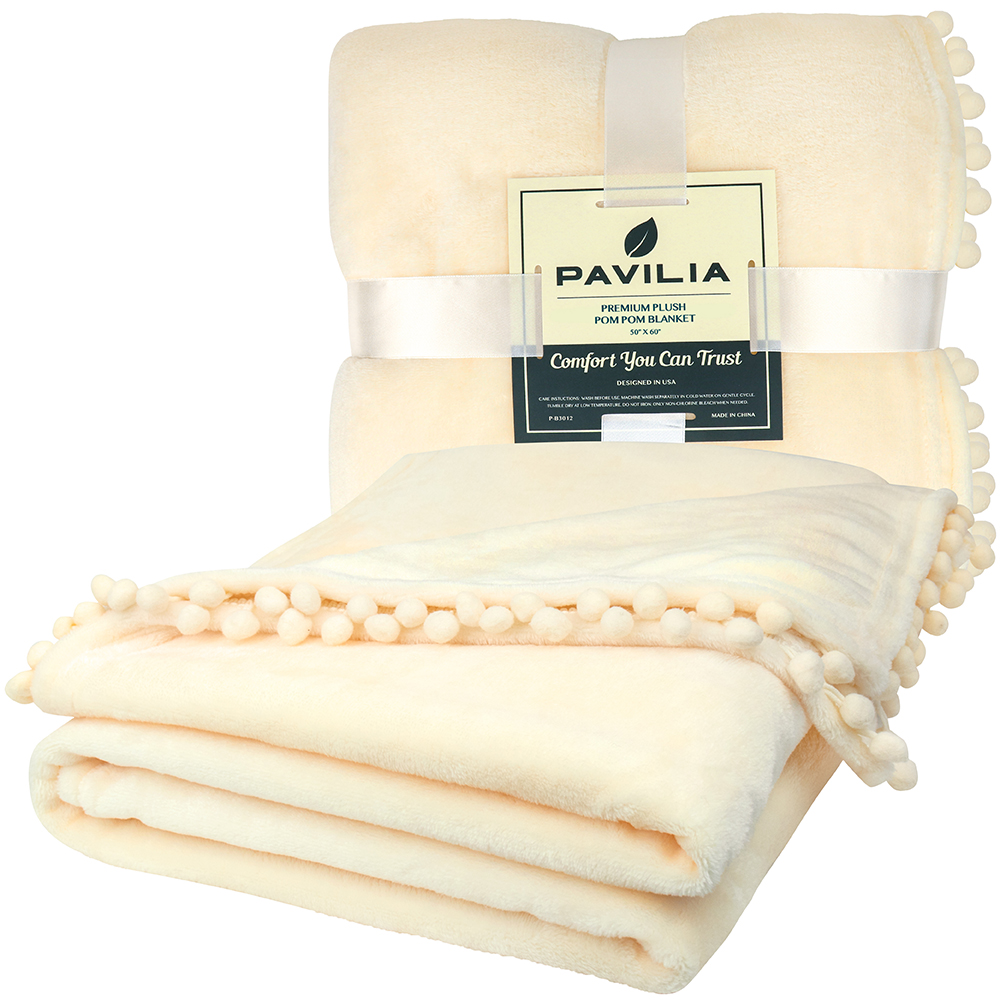 PAVILIA Fleece Throw Blanket for Couch with Pom Pom Fringe, Cream Beige, Soft Cozy Fuzzy Flannel Blanket for Sofa Bed, Lightweight Plush All Season Throw, 50x60 Inches