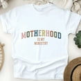 thumbnail image 1 of T-Shirt Chrétien "Motherhood Is My Ministry", Blanc, Taille 3TG, 1 of 6