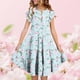 thumbnail image 2 of Vestido de Verano de Manga Corta para Niñas con Estampado de Flores, Bolsillos Acanalados, Cuello Redondo, Mezcla Cómoda de Poliéster Spandex, 2 of 6