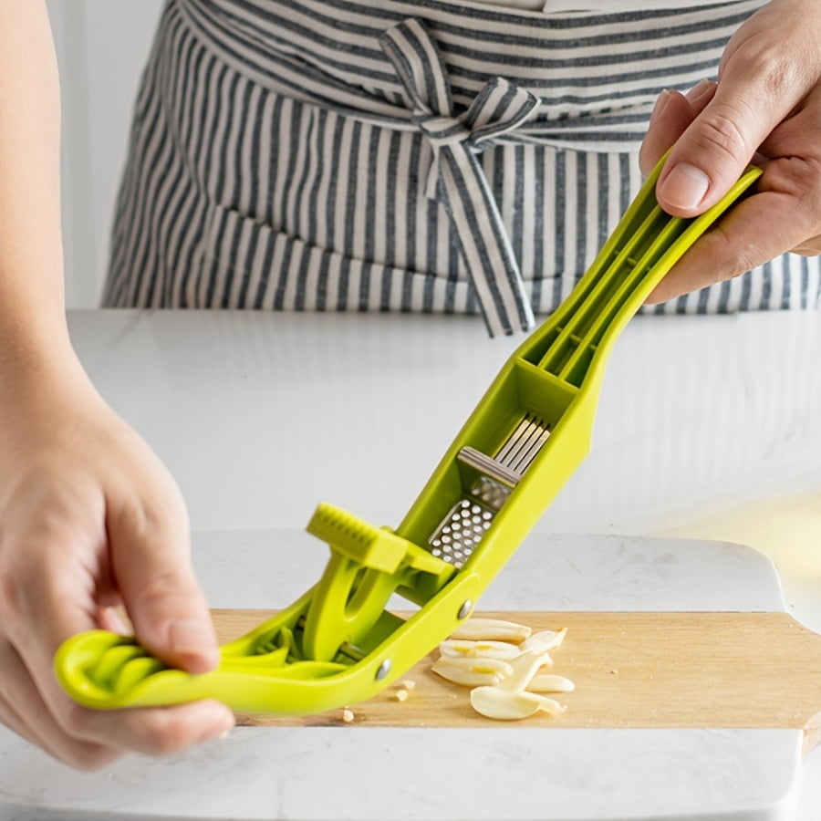 Stainless steel two-in-one garlic press is a must-have garlic slicing tool in the kitchen. It is durable and easy to clean. It is suitable for families and professional chefs.