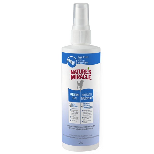 Nature’s Miracle Freshening Spray for Dogs, Clean Breeze scent, 8 fl oz spray bottle with blue and white label featuring a dog silhouette, designed to neutralize pet odors and freshen dog coats safely between baths.