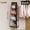 Black, variant on Foldable wall-mounted hanging storage shelf with Oxford cloth. Space-saving for wardrobe, bedroom, entryway. Holds handbags, wallets, purses. Fabric shelf system.